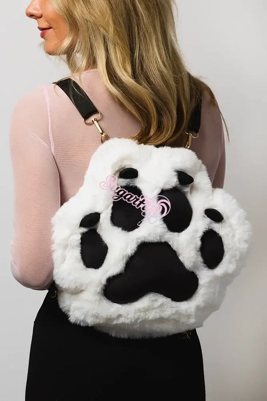 Back view of woman wearing light up rave backpack