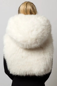 Back view of the white faux fur vest, showing the texture of the material and the size of the hood from behind