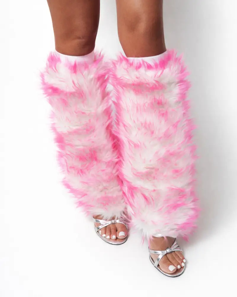 Women’s pink and white furry leg warmers with white background styled for festival fashion and Burning Man outfits
