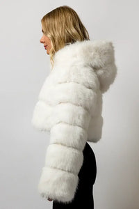 Blonde model wearing a SugarFur Prism White LED Coat from the side showing fluffy texture of coat