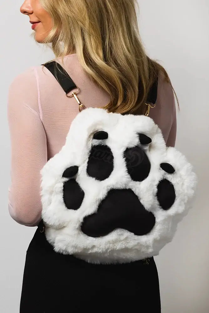 Back view of woman wearing light up rave backpack