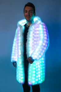 Male model wearing the SugarFur Snow Angel LED Coat, illuminated with a teal and white checkerboard light pattern.