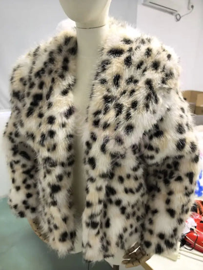 Leopard print fur coat on a mannequin against a neutral background