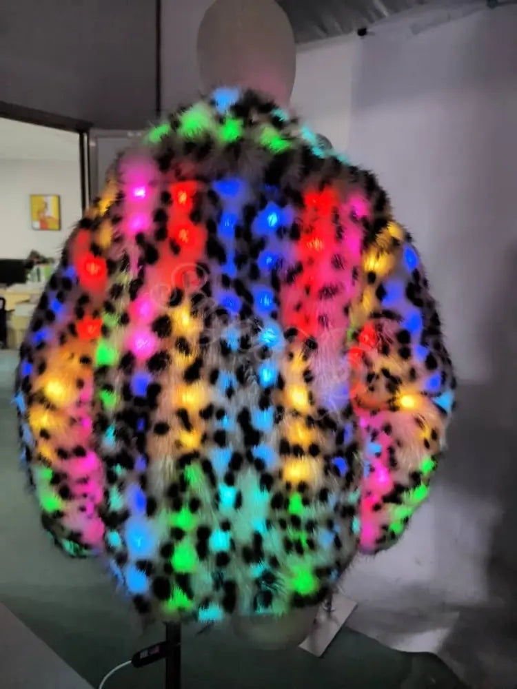 Mannequin wearing a colorful LED jacket in an indoor setting